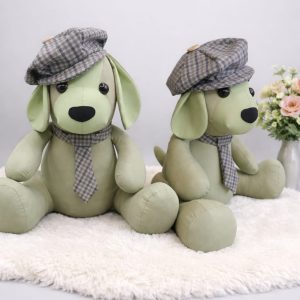 Two memory dogs wearing tweed flat caps and ties