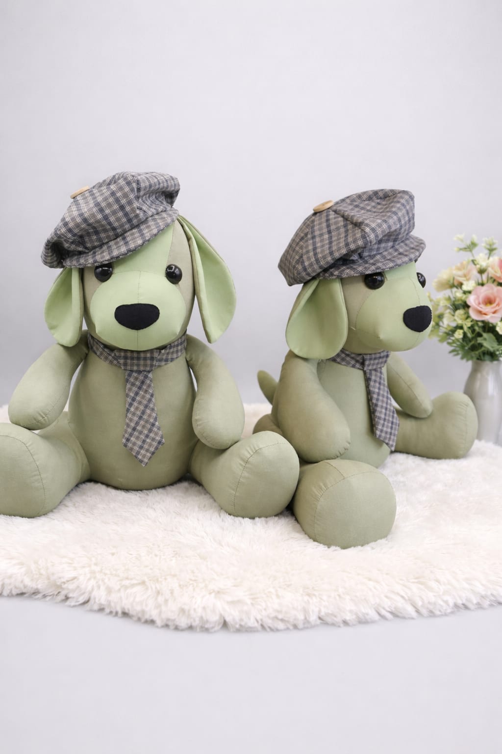 Two memory dogs wearing tweed flat caps and ties